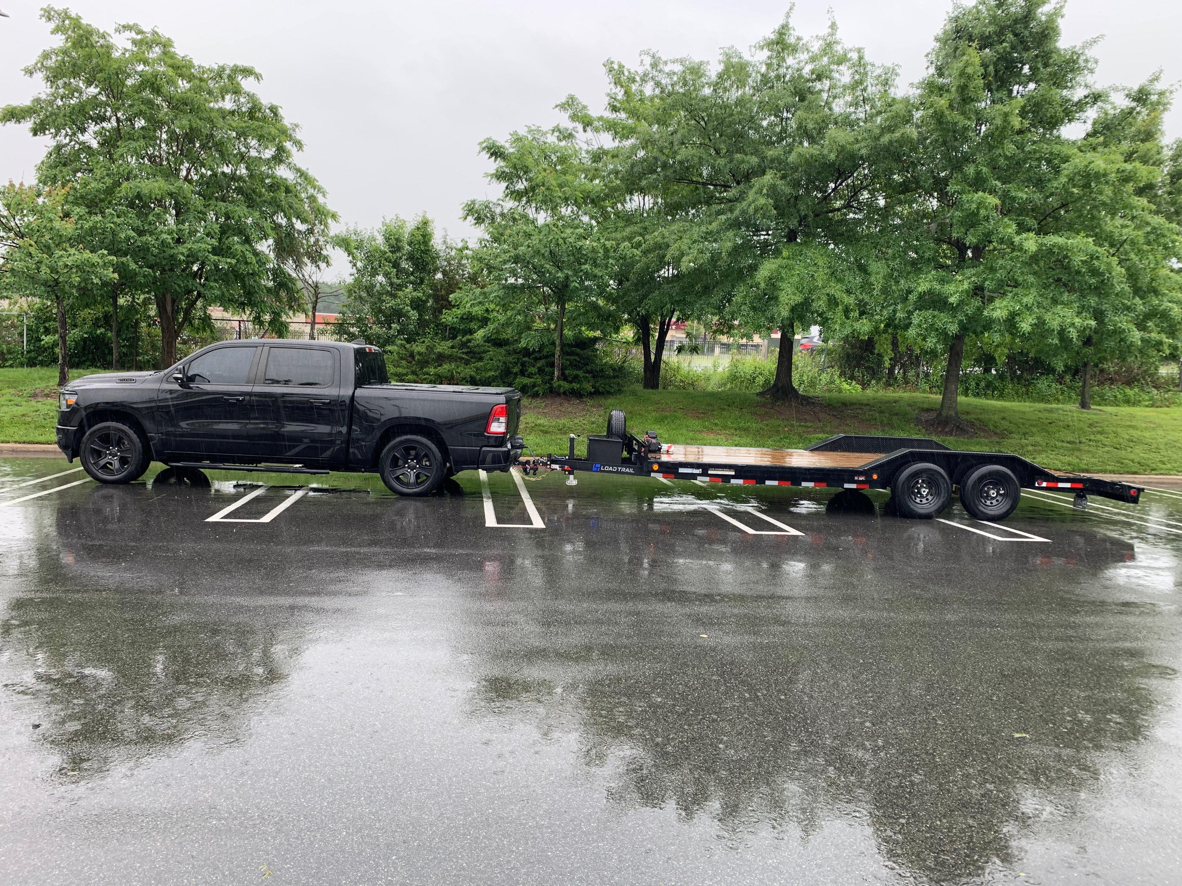 Truck towing D&M flatbed trailer rental